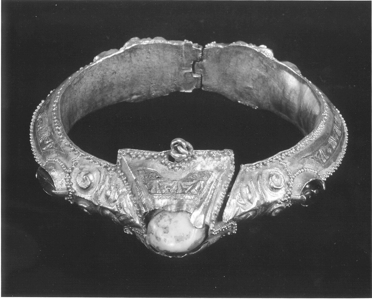 Bracelet, Gold, fabricated from sheet, decorated with bitumen-highlighted incising, granulation, and repoussé, set with glazed quartz, ruby, garnet, and, originally, two other stones