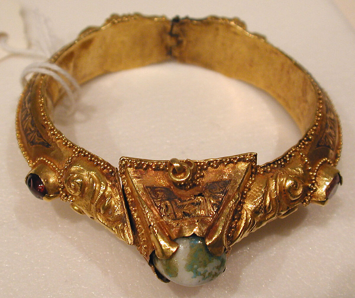 Bracelet, Gold, fabricated from sheet, decorated with bitumen-highlighted incising, granulation, and repoussé, set with glazed quartz, ruby, garnet, and, originally, two other stones