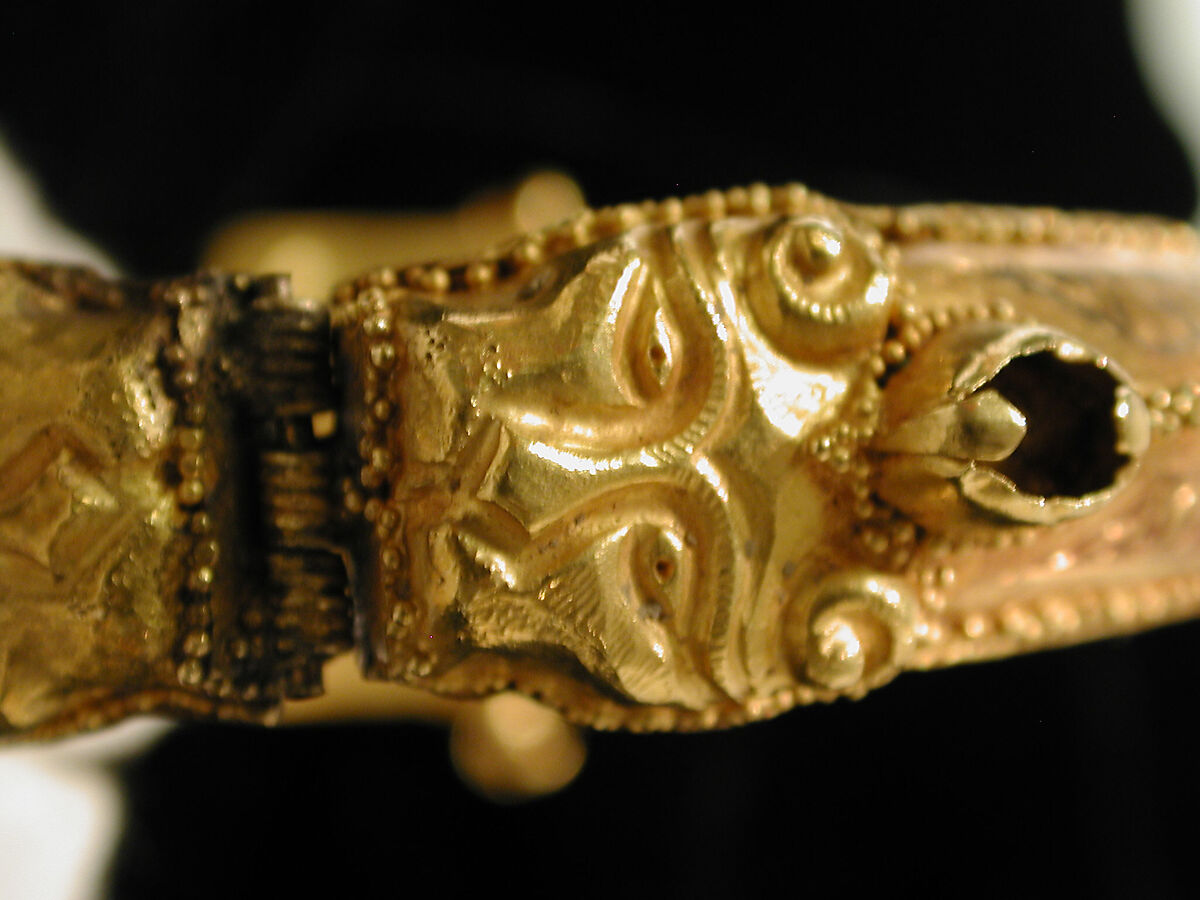 Bracelet, Gold, fabricated from sheet, decorated with bitumen-highlighted incising, granulation, and repoussé, set with glazed quartz, ruby, garnet, and, originally, two other stones