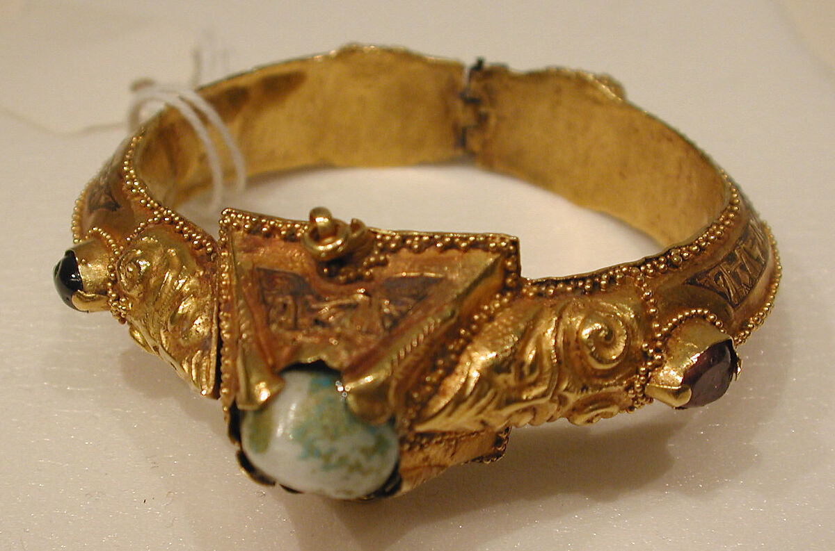 Bracelet, Gold, fabricated from sheet, decorated with bitumen-highlighted incising, granulation, and repoussé, set with glazed quartz, ruby, garnet, and, originally, two other stones