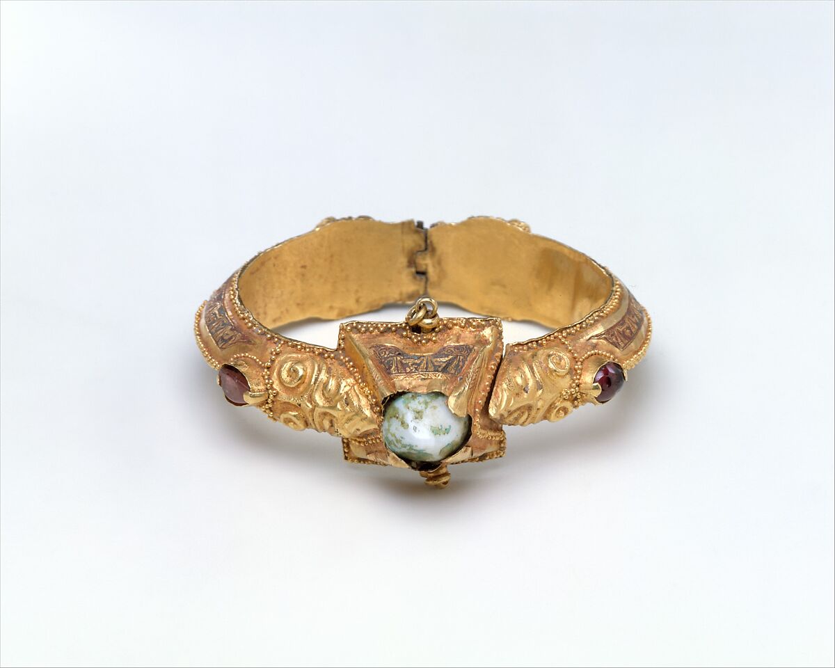 Bracelet, Gold, fabricated from sheet, decorated with bitumen-highlighted incising, granulation, and repoussé, set with glazed quartz, ruby, garnet, and, originally, two other stones 
