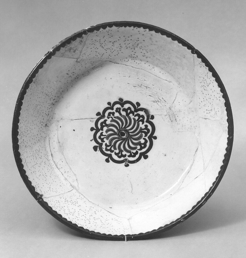 Bowl with Rosette, Earthenware; white slip with polychrome slip decoration under transparent glaze