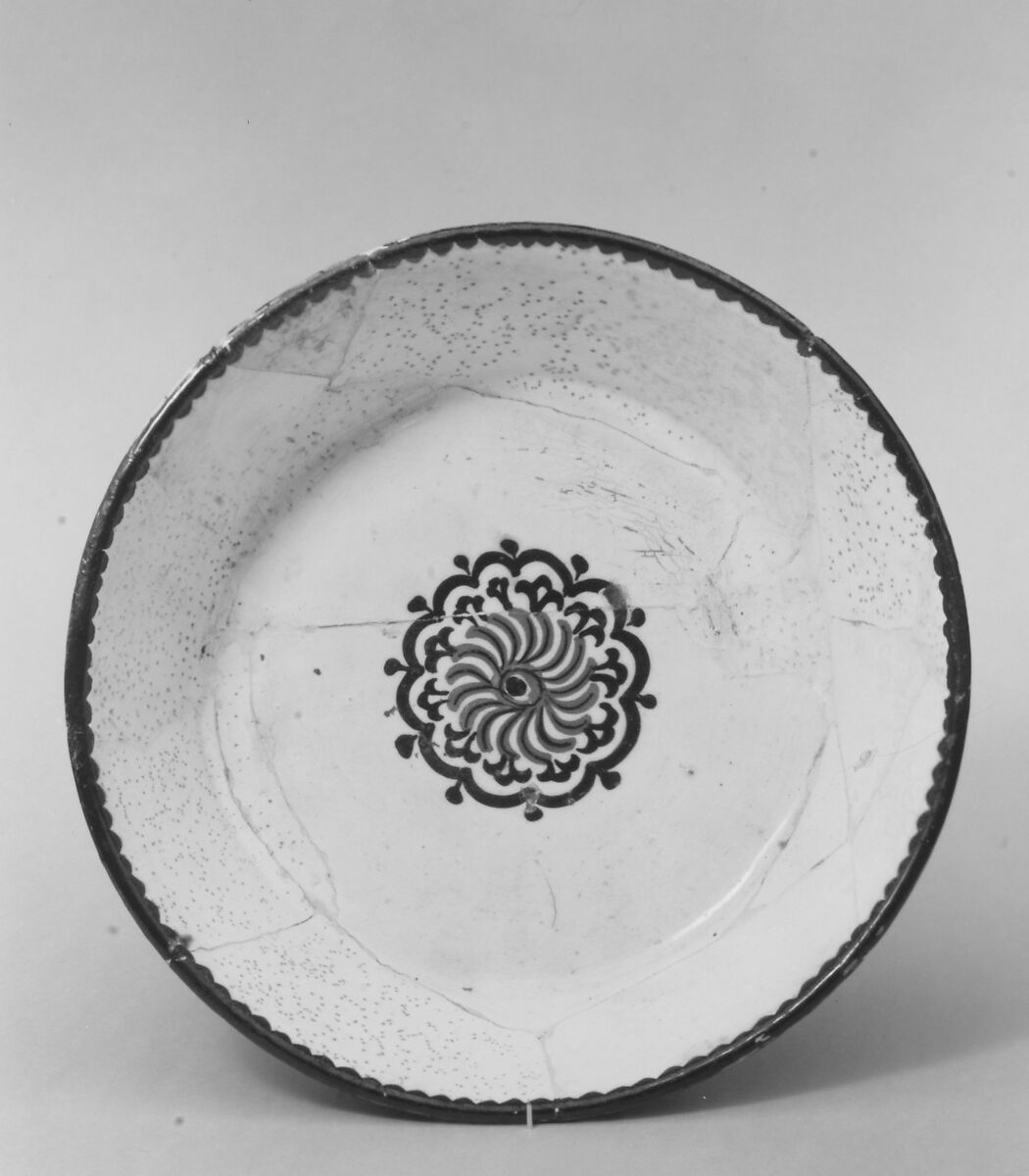 Bowl with Rosette, Earthenware; white slip with polychrome slip decoration under transparent glaze