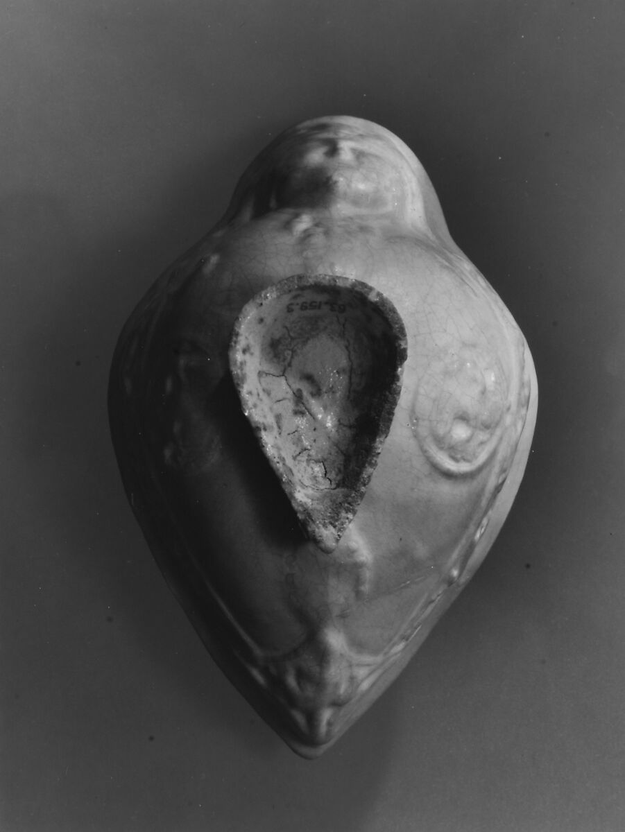 Boat-Shaped Bowl with Human Head and Animals, Stonepaste; molded, opaque white glaze