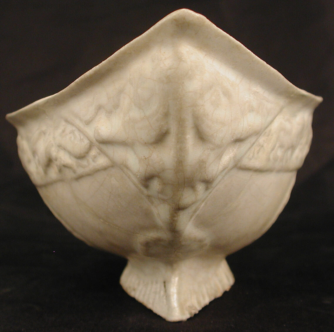Boat-Shaped Bowl with Human Head and Animals, Stonepaste; molded, opaque white glaze