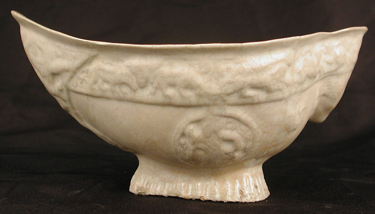 Boat-Shaped Bowl with Human Head and Animals, Stonepaste; molded, opaque white glaze