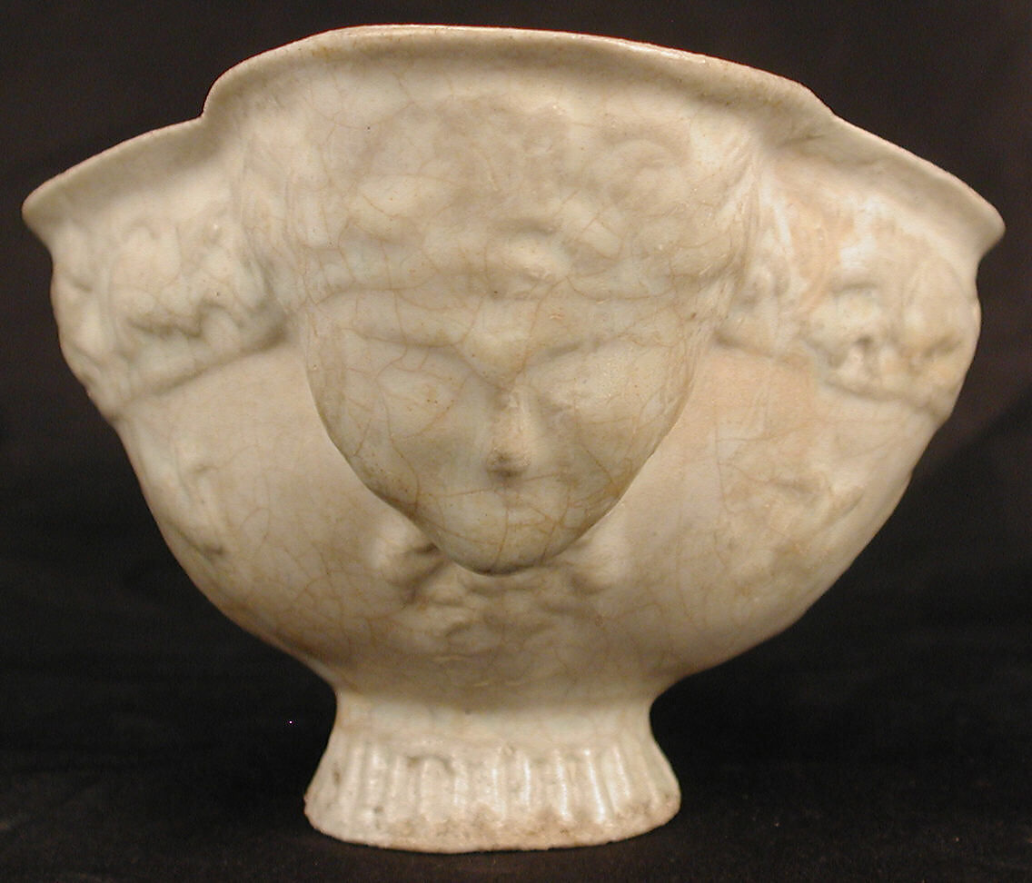 Boat-Shaped Bowl with Human Head and Animals, Stonepaste; molded, opaque white glaze