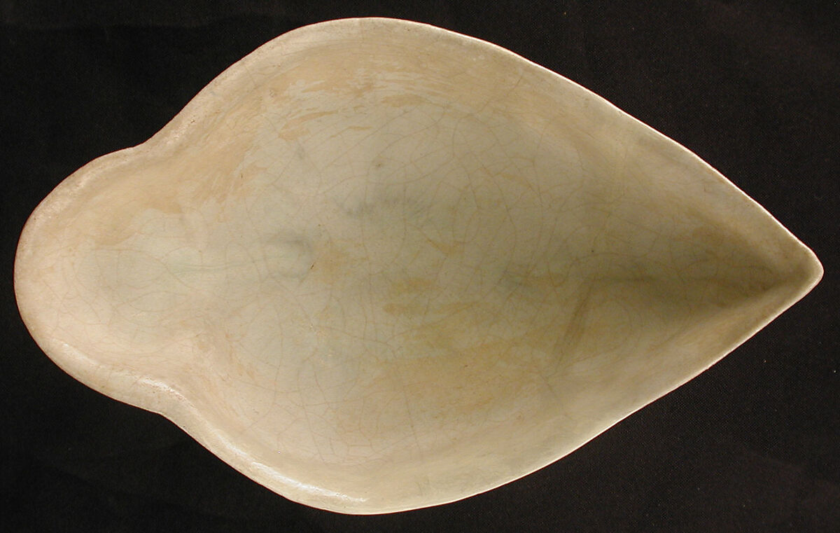 Boat-Shaped Bowl with Human Head and Animals, Stonepaste; molded, opaque white glaze
