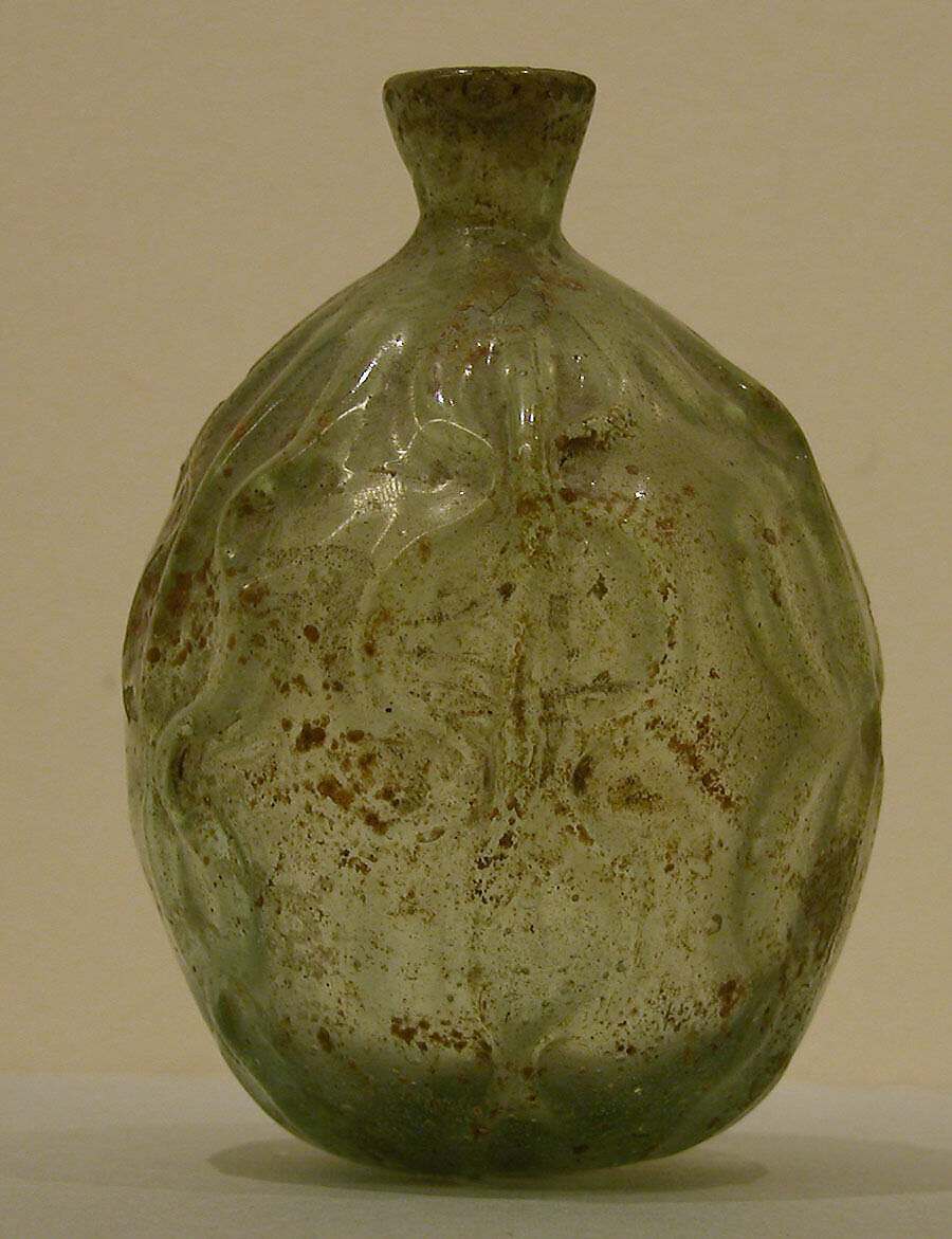 Bottle, Glass, greenish; mold blown, tooled, and free blown