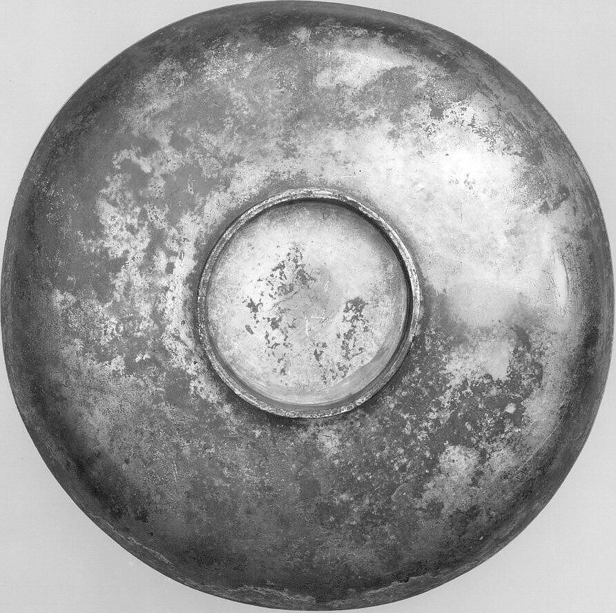 Plate Depicting a Female Figure Riding a Fantastic Winged Beast, Silver; gilded, chased, and engraved, with applied elements