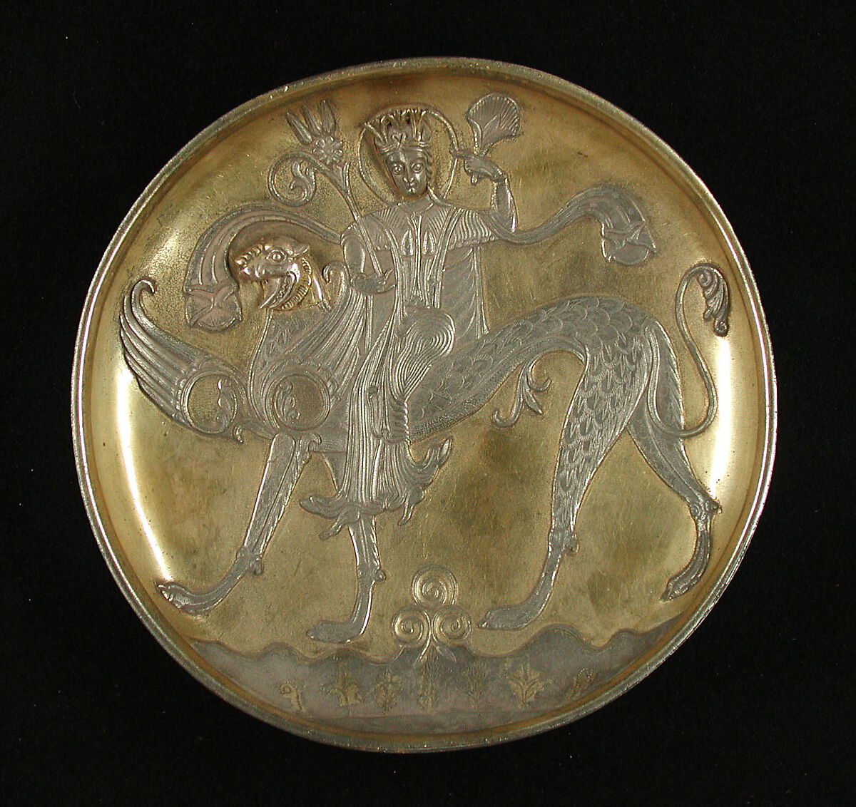 Plate Depicting a Female Figure Riding a Fantastic Winged Beast, Silver; gilded, chased, and engraved, with applied elements
