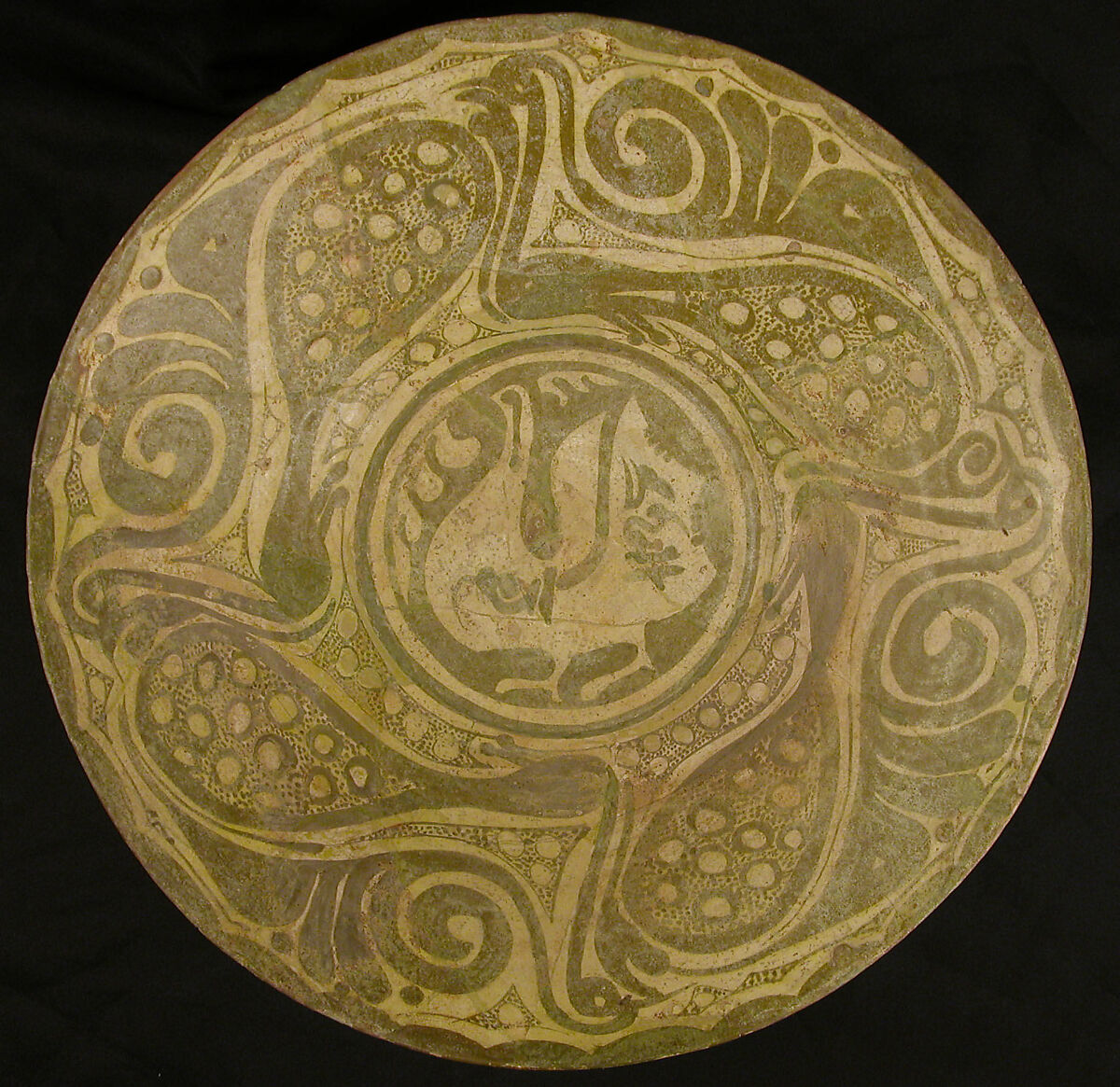 Bowl, Earthenware; white slip, slip decoration in green luster 