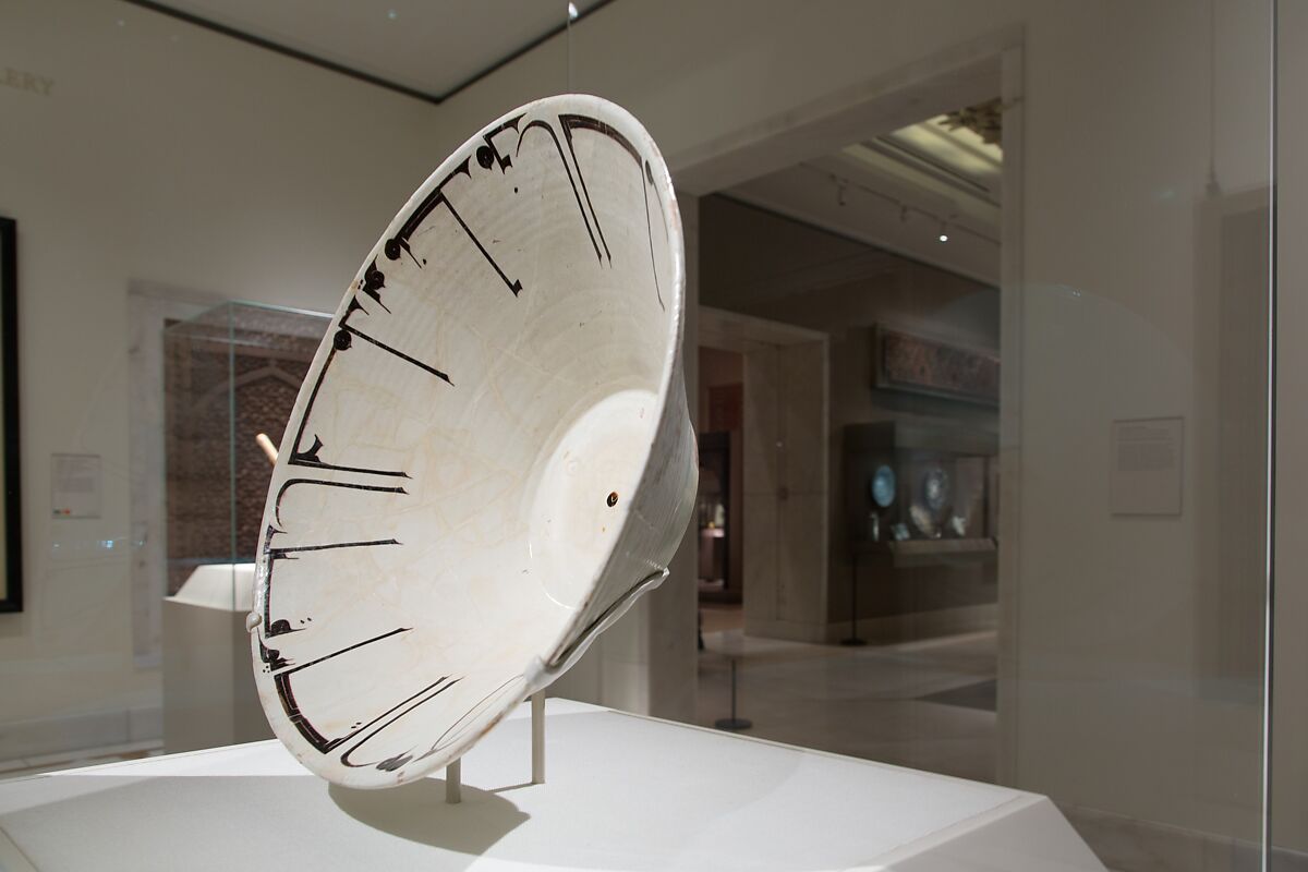 Bowl with Arabic Inscription, Earthenware; white slip with black-slip decoration under transparent glaze
