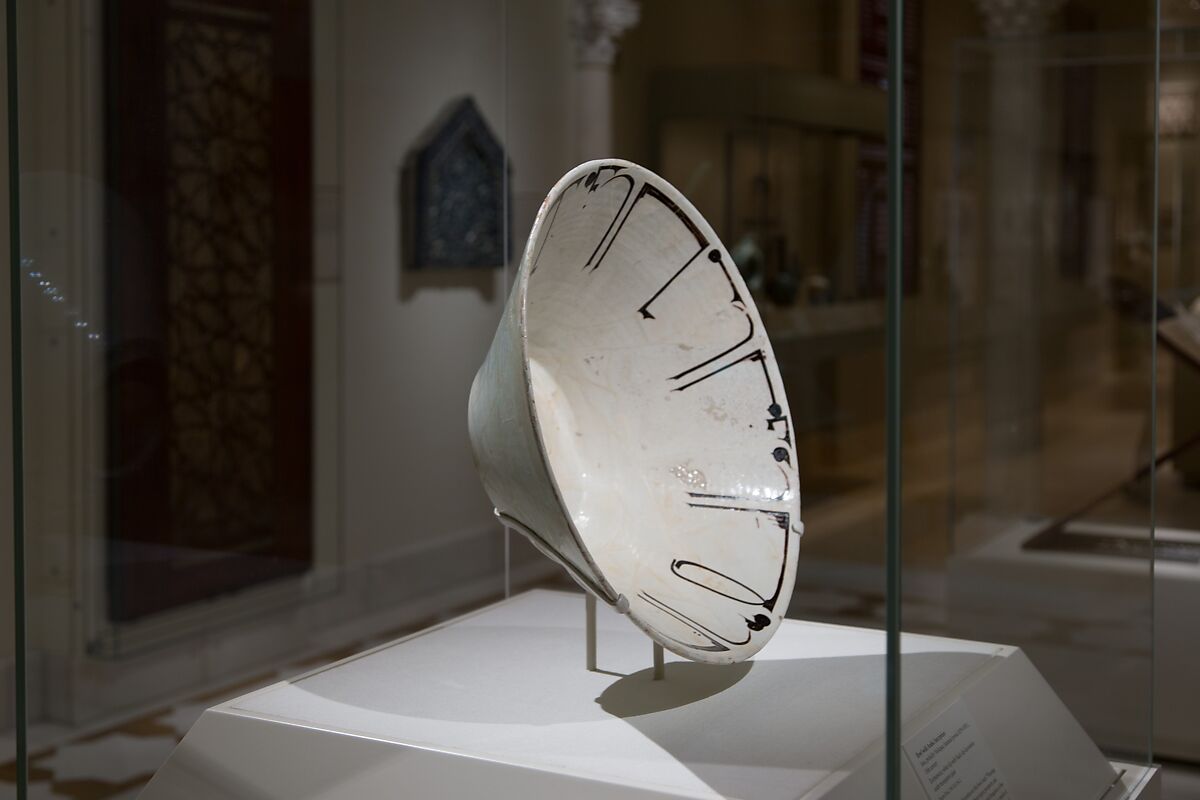 Bowl with Arabic Inscription, Earthenware; white slip with black-slip decoration under transparent glaze