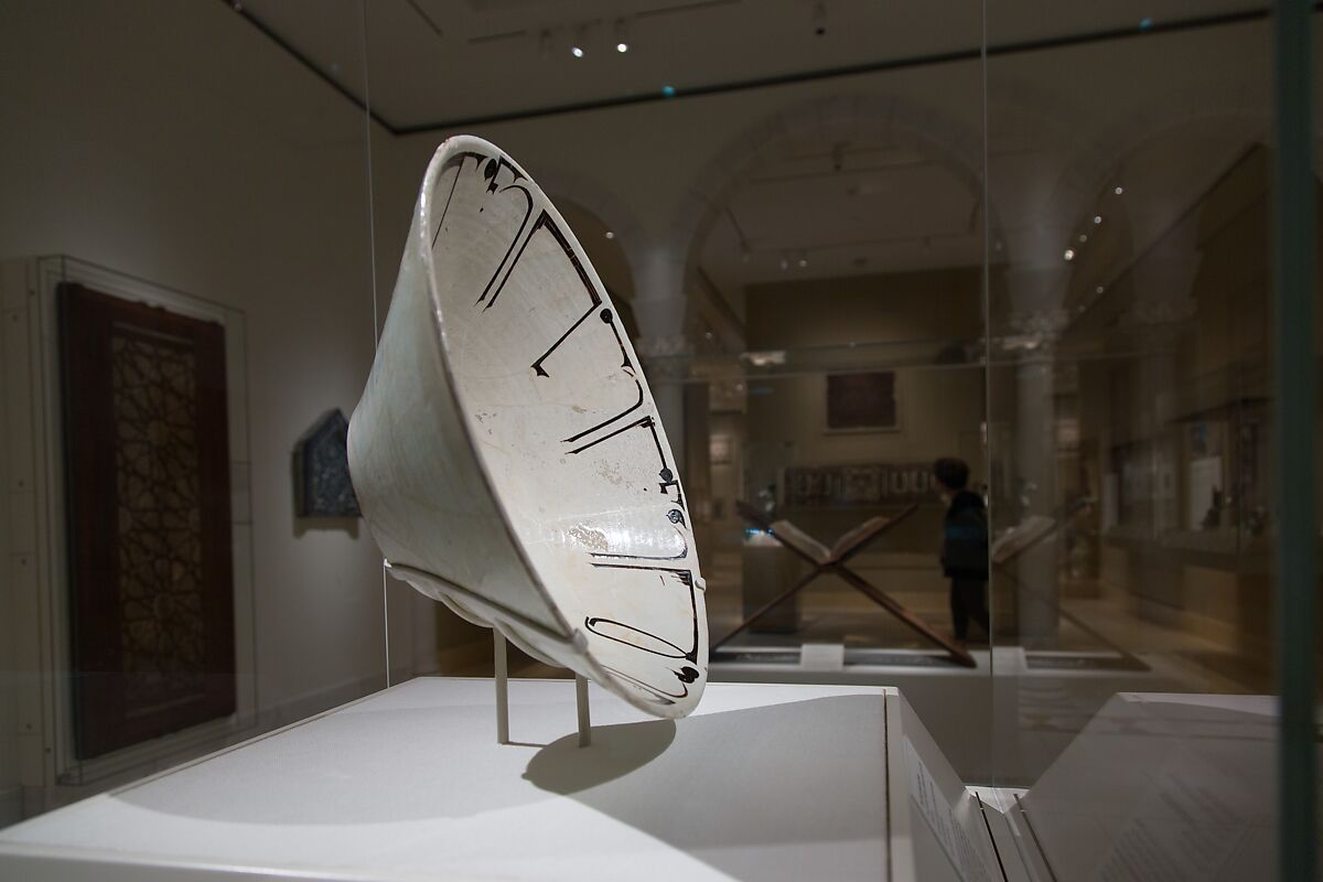 Bowl with Arabic Inscription, Earthenware; white slip with black-slip decoration under transparent glaze