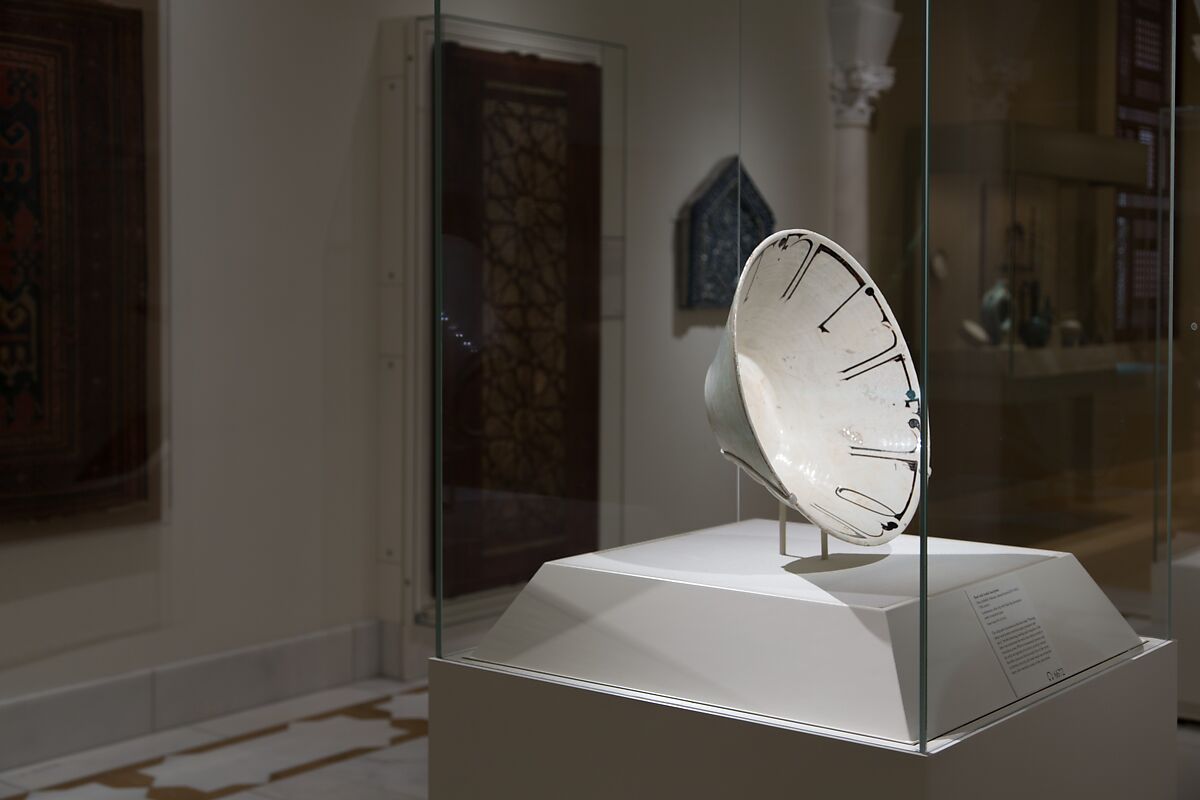 Bowl with Arabic Inscription, Earthenware; white slip with black-slip decoration under transparent glaze