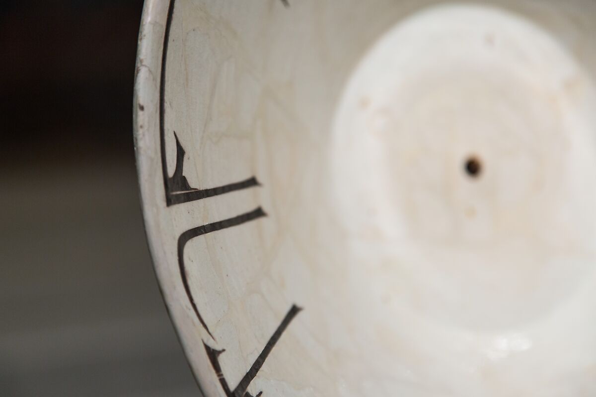 Bowl with Arabic Inscription, Earthenware; white slip with black-slip decoration under transparent glaze