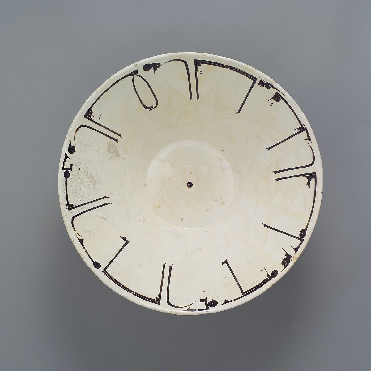 Bowl with Arabic Inscription, Earthenware; white slip with black-slip decoration under transparent glaze 