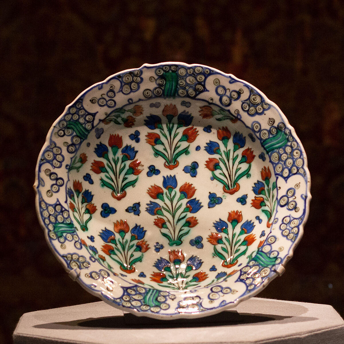 Dish with Pattern of Flowering Plants, Stonepaste; polychrome painted under transparent glaze 