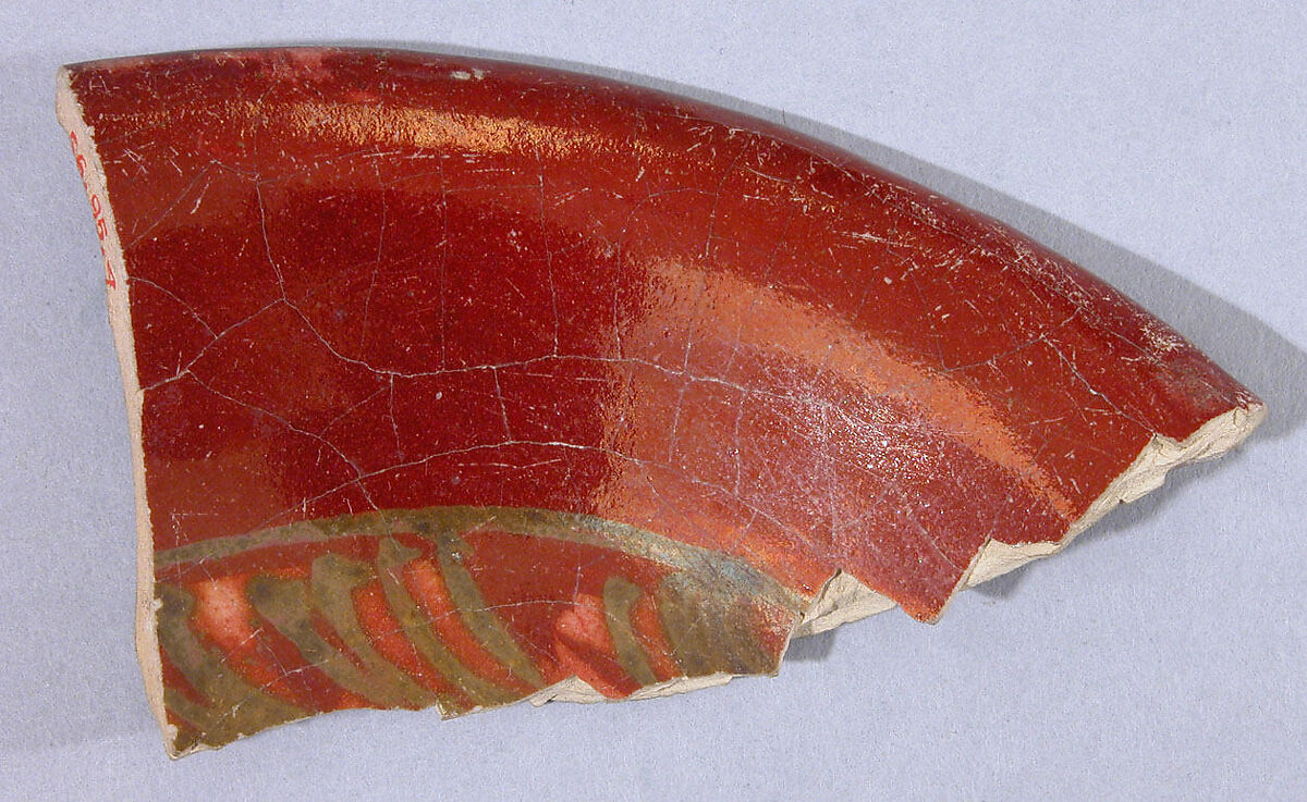 Fragment of a Ruby Luster Bowl Painted in Goldish Luster, Earthenware; polychrome luster-painted 