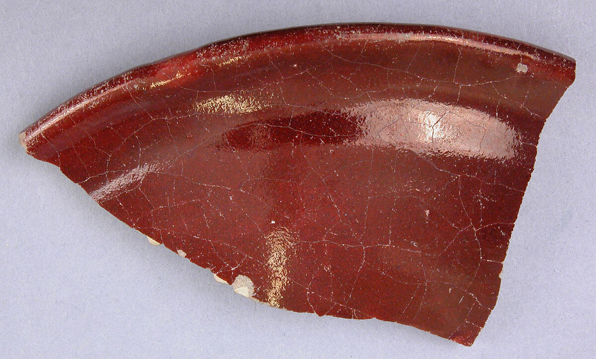 Fragment of a Ruby Luster Bowl Painted in Goldish Luster, Earthenware; polychrome luster-painted