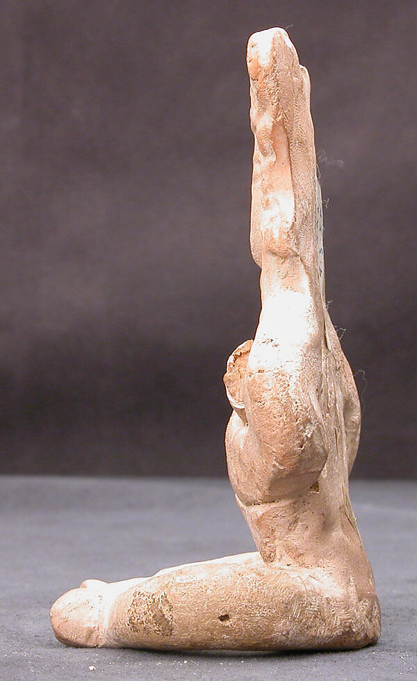 Figurine of a Seated Personage with Folded Arms and Elaborate Headdress, Earthenware; unglazed