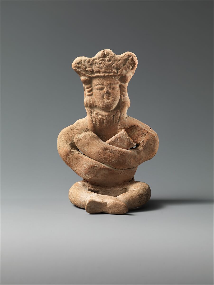 Figurine of a Seated Personage with Folded Arms and Elaborate Headdress, Earthenware; unglazed 