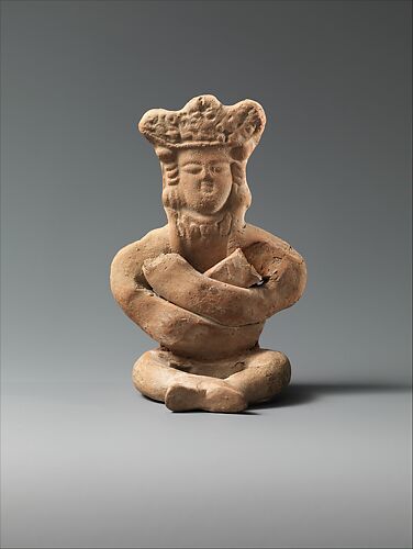 Figurine of a Seated Personage with Folded Arms and Elaborate Headdress
