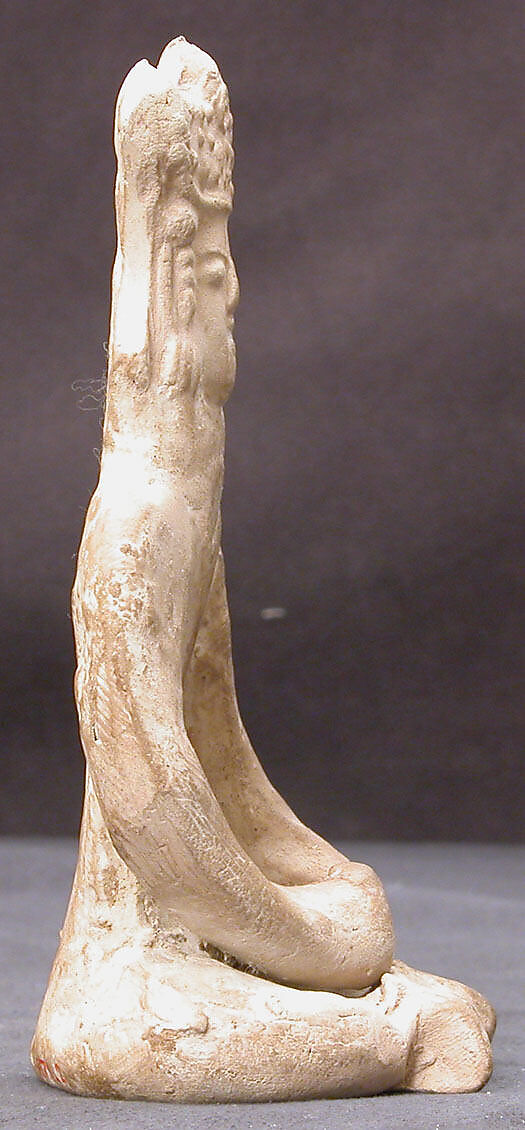 Figurine of a Female (?) Seated Personage with Elaborate Headdress, Earthenware; unglazed