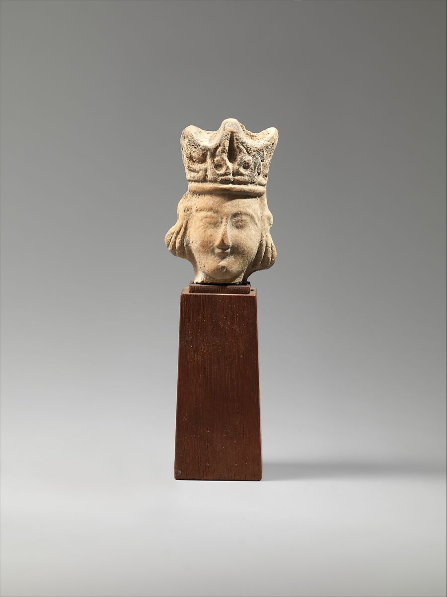 Head of a Figurine with an Elaborate Headdress, Earthenware; unglazed 