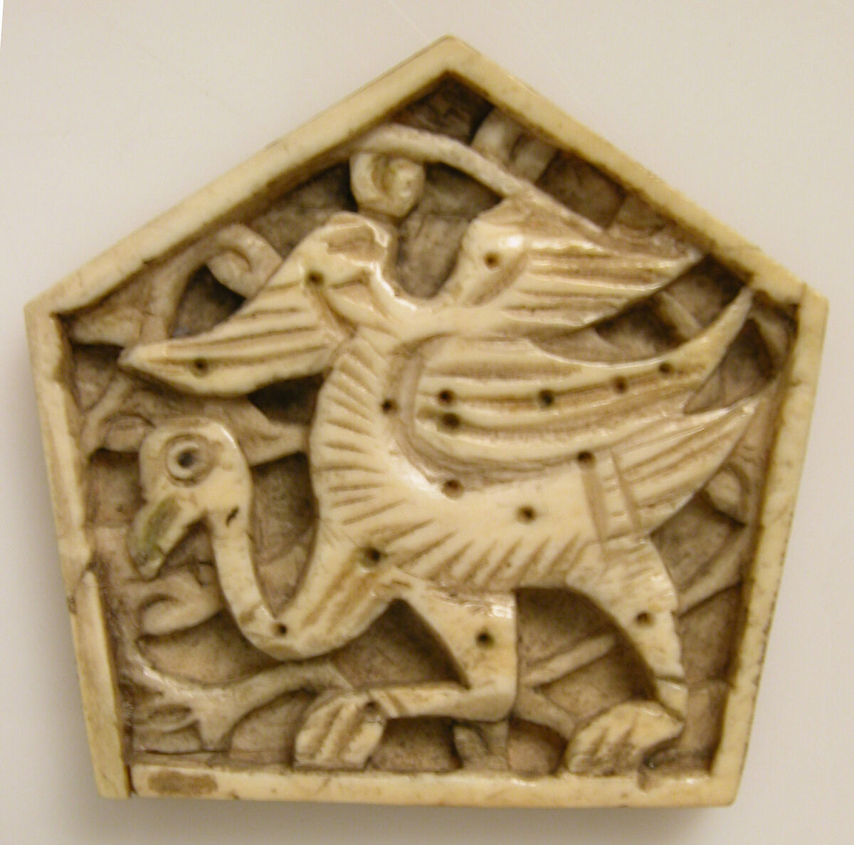Plaque, Bone; carved and incised 