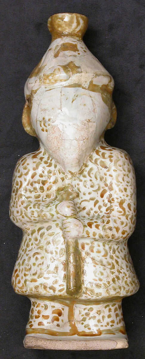 Hollow Vessel in the Shape of a Bearded man, Stonepaste; molded, luster-painted on opaque white glaze 