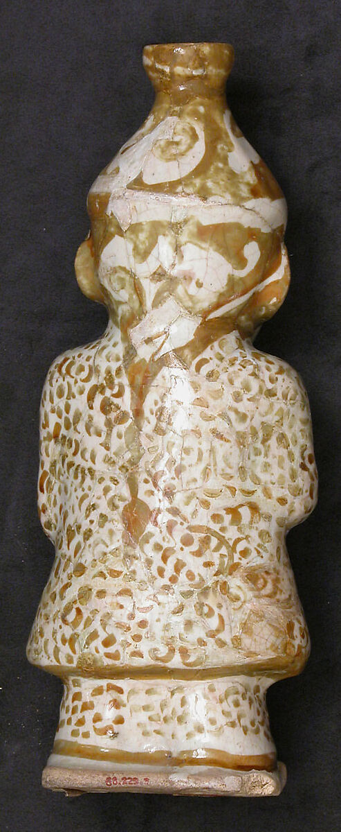 Hollow Vessel in the Shape of a Bearded man, Stonepaste; molded, luster-painted on opaque white glaze