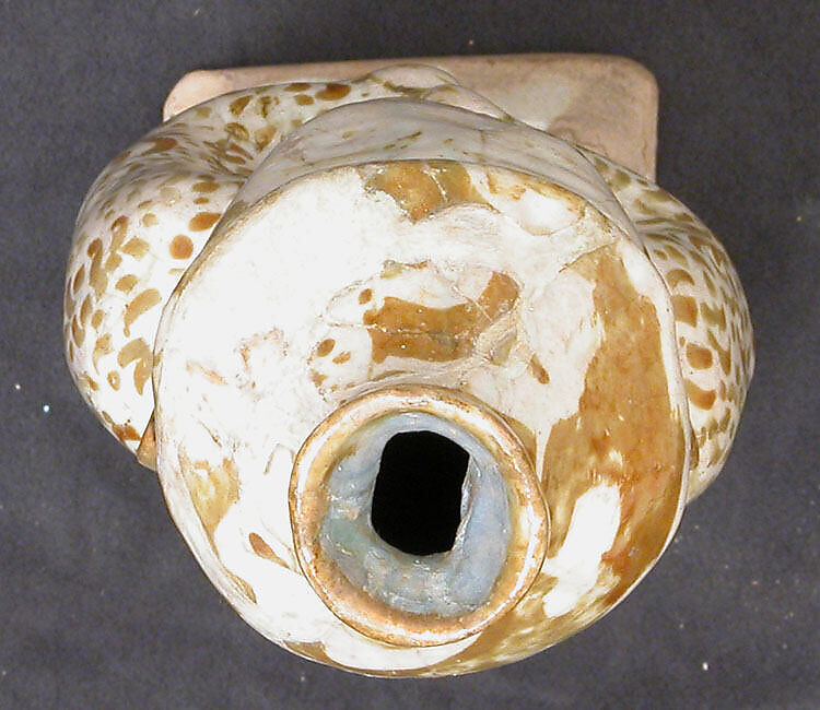 Hollow Vessel in the Shape of a Bearded man, Stonepaste; molded, luster-painted on opaque white glaze