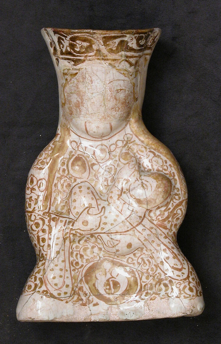Hollow Vessel in the Shape of a Woman Holding a Child, Stonepaste; molded, luster-painted on an opaque white glaze 
