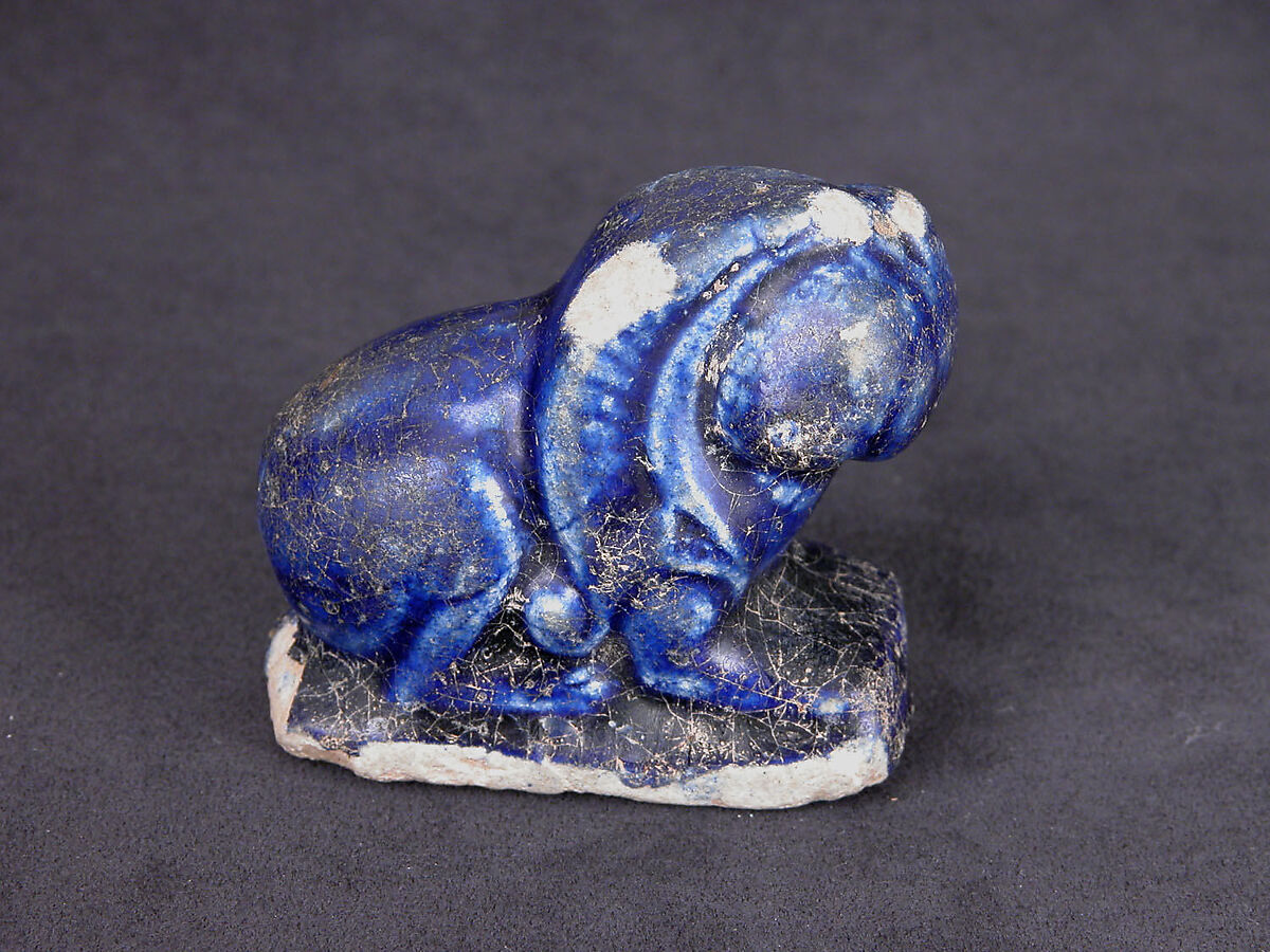 Bath Scraper in the Shape of a Lion, Stonepaste; molded, incised, glazed in transparent blue