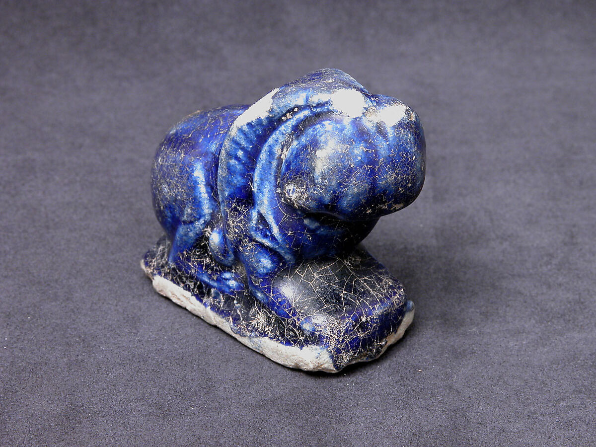 Bath Scraper in the Shape of a Lion, Stonepaste; molded, incised, glazed in transparent blue