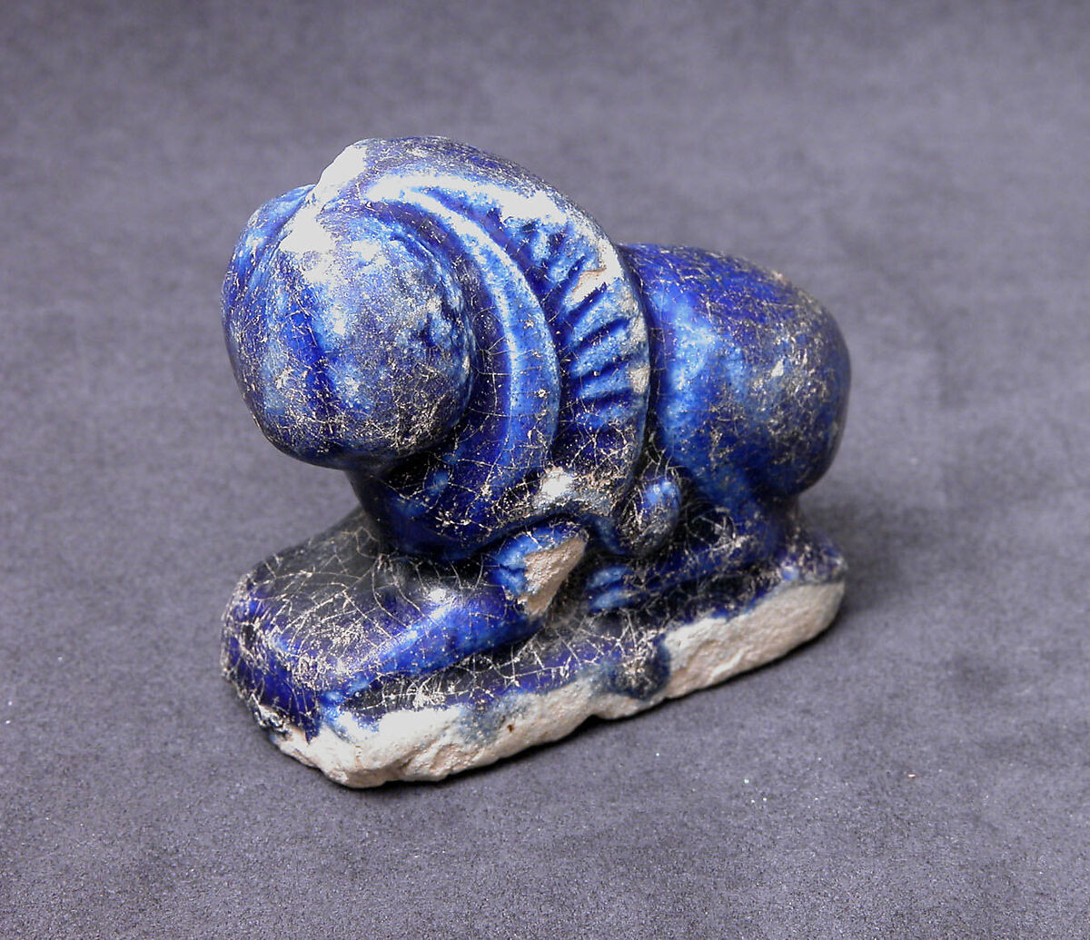 Bath Scraper in the Shape of a Lion, Stonepaste; molded, incised, glazed in transparent blue
