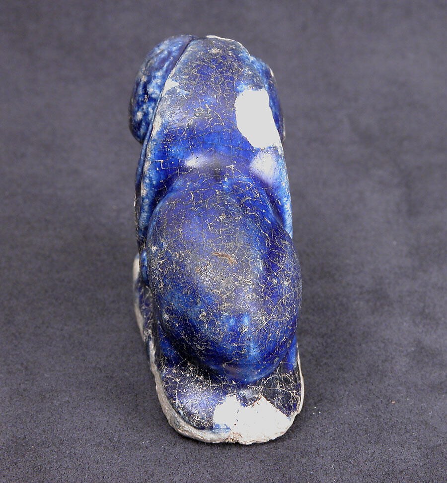 Bath Scraper in the Shape of a Lion, Stonepaste; molded, incised, glazed in transparent blue