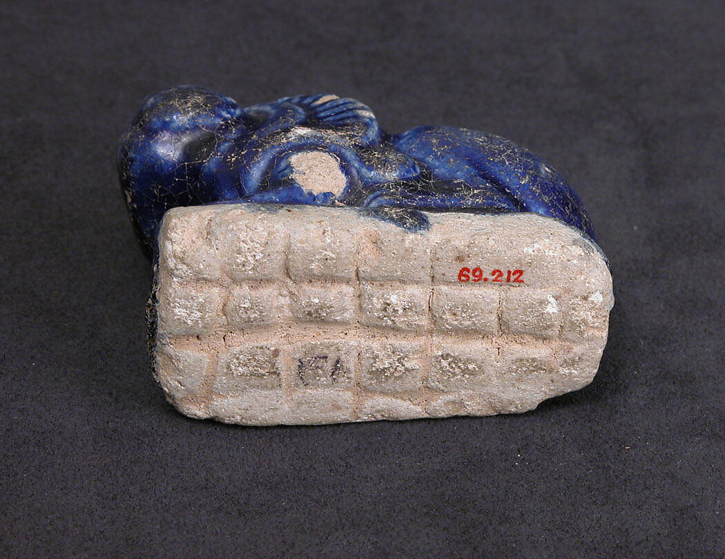 Bath Scraper in the Shape of a Lion, Stonepaste; molded, incised, glazed in transparent blue