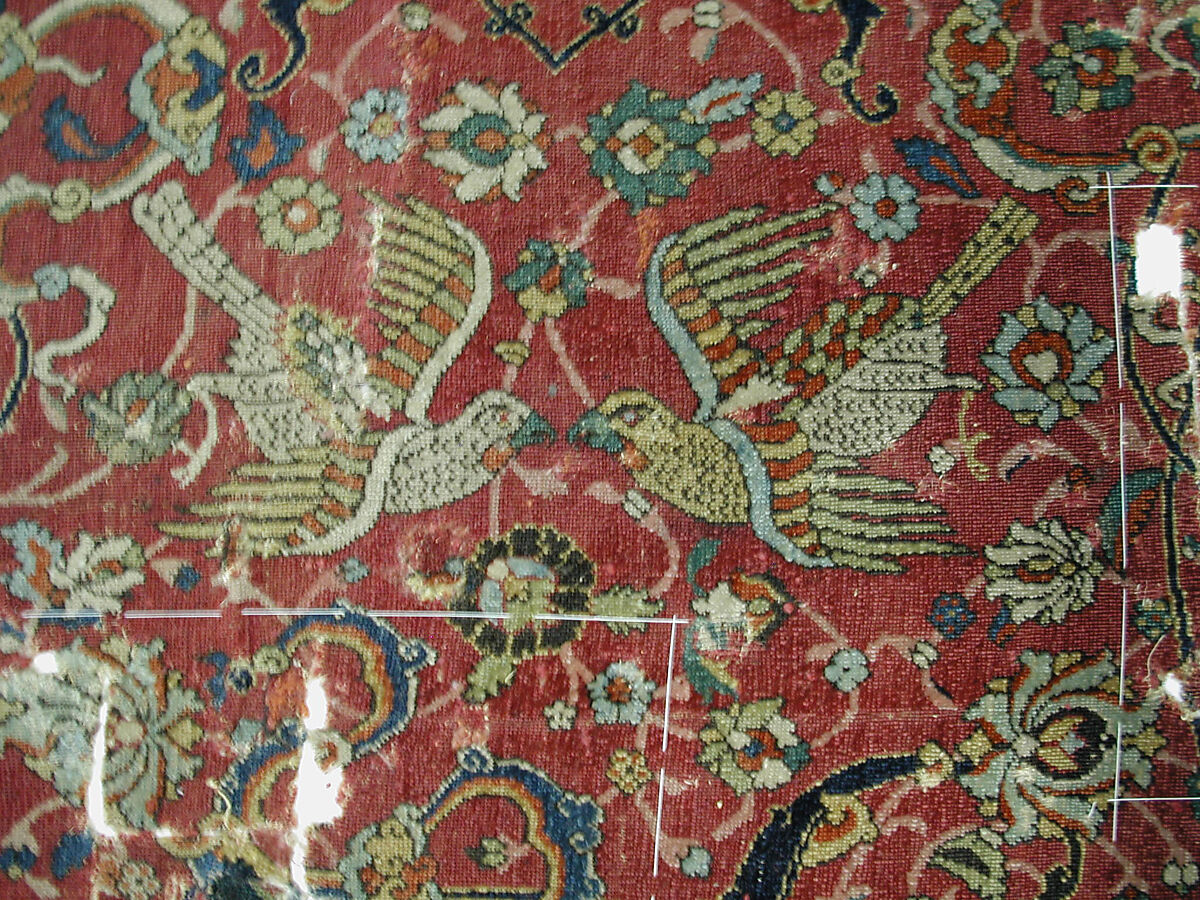 Fragment of a Carpet with Cartouche Border, Silk (warp and weft), wool (pile); asymmetrically knotted pile
