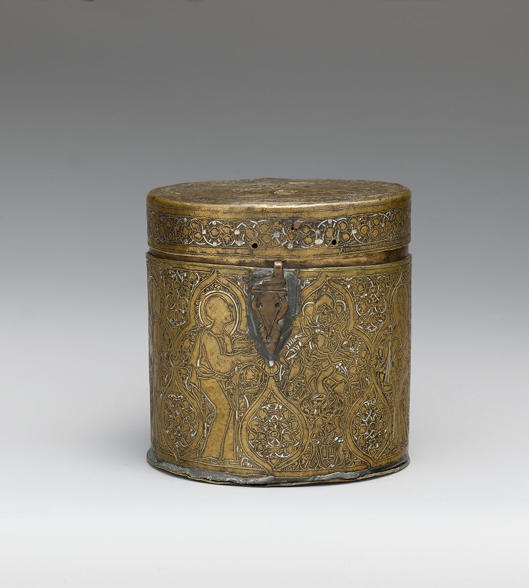 Pyxis Depicting Standing Saints or Ecclesiastics and the Entry into Jerusalem with Christ Riding a Donkey, Brass; hammered, engraved, inlaid with silver 