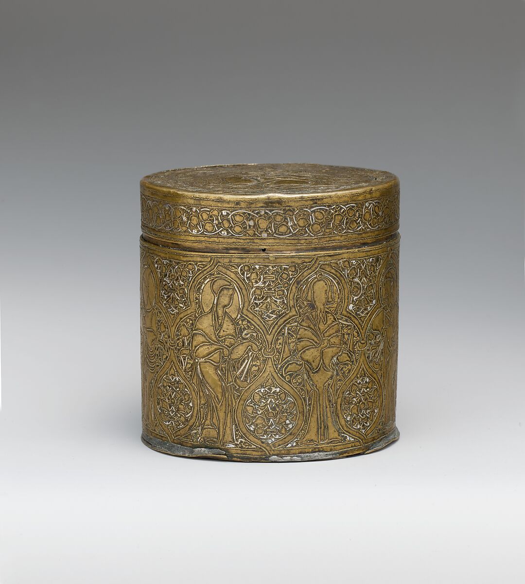 Pyxis Depicting Standing Saints or Ecclesiastics and the Entry into Jerusalem with Christ Riding a Donkey, Brass; hammered, engraved, inlaid with silver