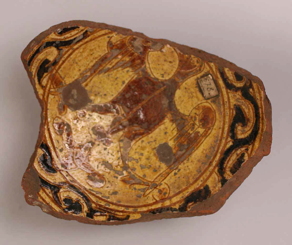 Fragment of a Bowl, Earthenware; incised decoration through white slip and coloring under transparent glaze 