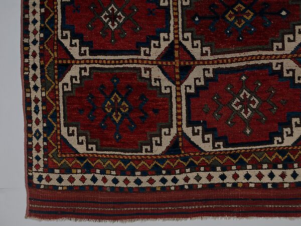 Carpet with Repeating Medallion Pattern on Red Background, Wool; (warp, weft, and pile); symmetrically knotted pile