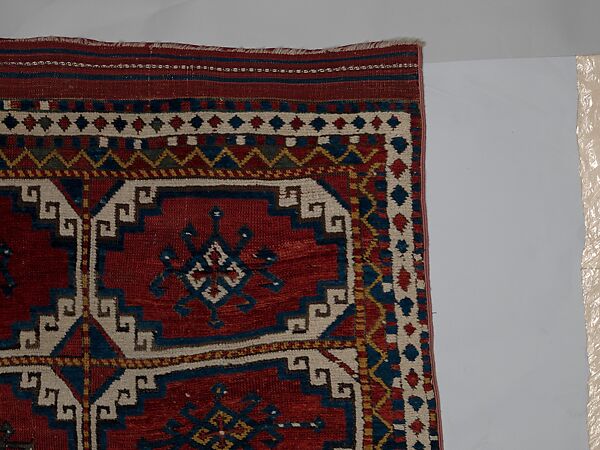 Carpet with Repeating Medallion Pattern on Red Background, Wool; (warp, weft, and pile); symmetrically knotted pile