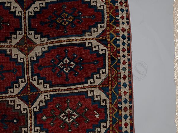 Carpet with Repeating Medallion Pattern on Red Background, Wool; (warp, weft, and pile); symmetrically knotted pile