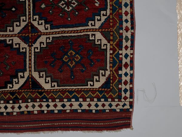 Carpet with Repeating Medallion Pattern on Red Background, Wool; (warp, weft, and pile); symmetrically knotted pile
