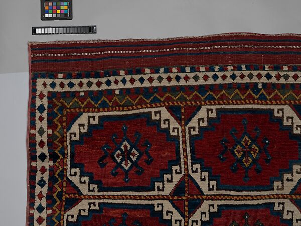 Carpet with Repeating Medallion Pattern on Red Background, Wool; (warp, weft, and pile); symmetrically knotted pile