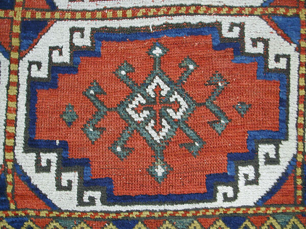 Carpet with Repeating Medallion Pattern on Red Background, Wool; (warp, weft, and pile); symmetrically knotted pile